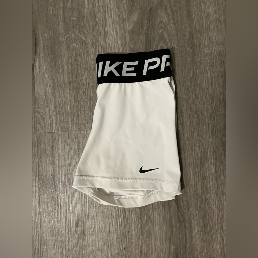 Women’s white Nike Pros